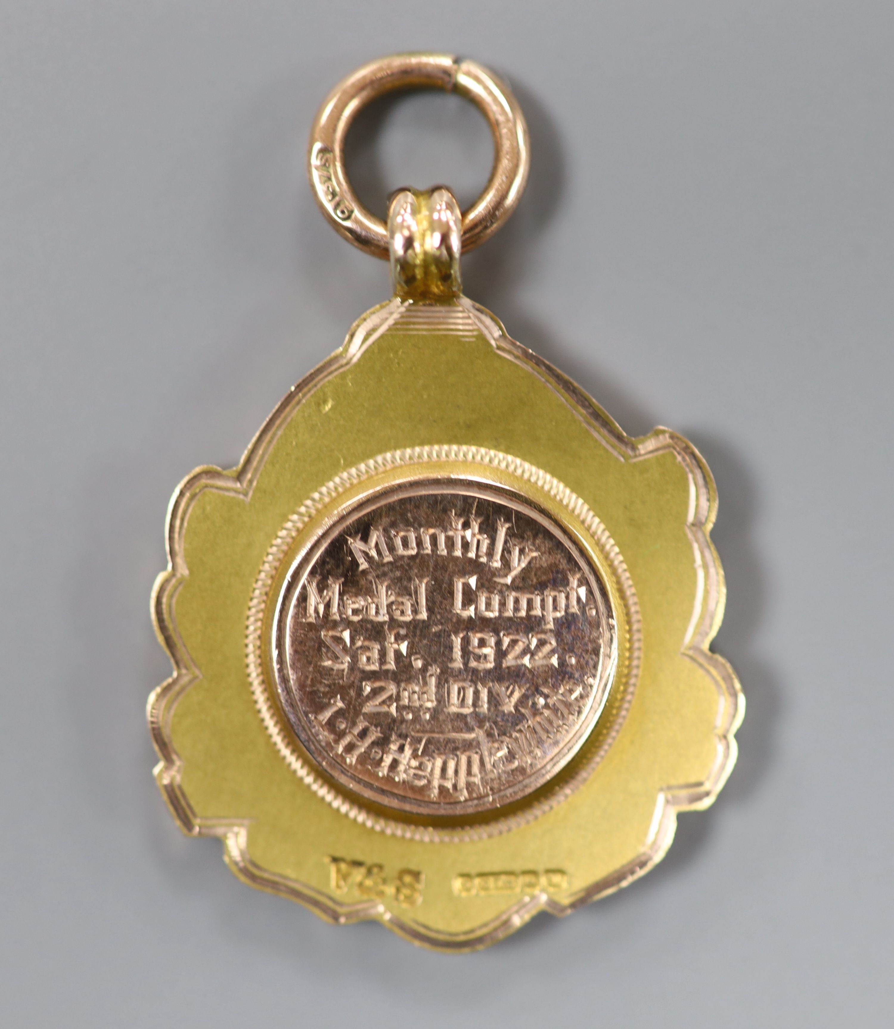 A cased George V Bulwell Forest Golf Club two colour 9ct gold presentation medal, Vaughton & Sons, Birmingham, 1921,